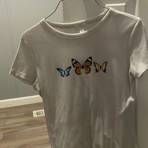 White top with butterflies